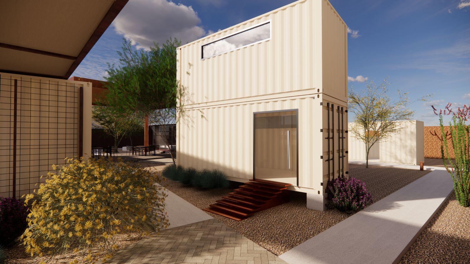 Entrada principal de Campus CIAE en día soleado, con contenedor marítimo café abierto, pérgola de acero corten al fondo y paisajismo nativo del desierto sonorense en floración