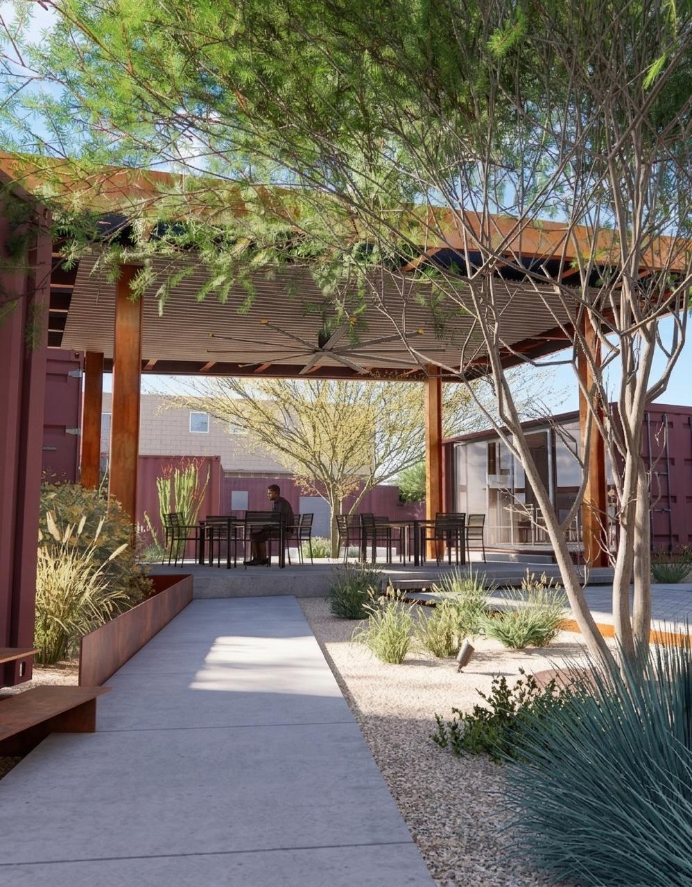 Detalle de paisajismo de Campus CIAE con ocotillos en floración roja